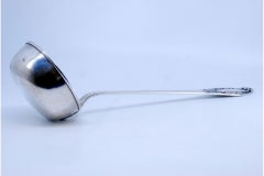 Silver soup ladle embossed on the handle involving a monogram cartouche