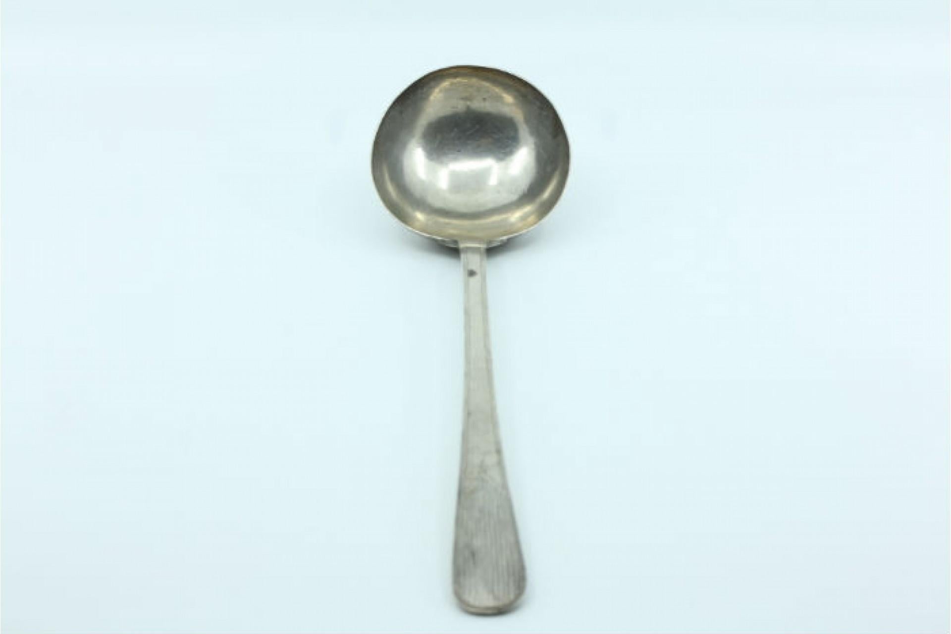 Description: Silver soup ladle in the shape of a shell with grooves along the raised handle. Metal: Silver. Origin: Portugal. Brand: Porto Coroa. Weight: 164.50 grams. Dimensions: 27cm x 5.2cm. Content: 833/1000. Assay Mark: Yes, from the 15th