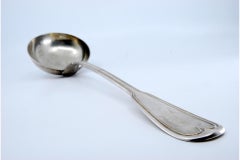 Silver soup ladle with a frieze along the handle to be shipped