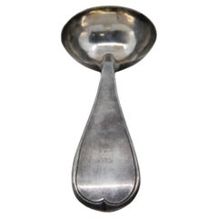 Silver soup ladle with a frieze along the handle to be shipped
