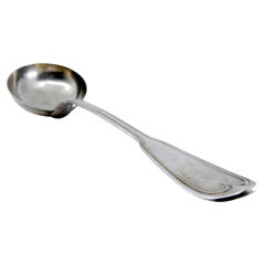 Silver soup ladle with a frieze along the handle to be shipped