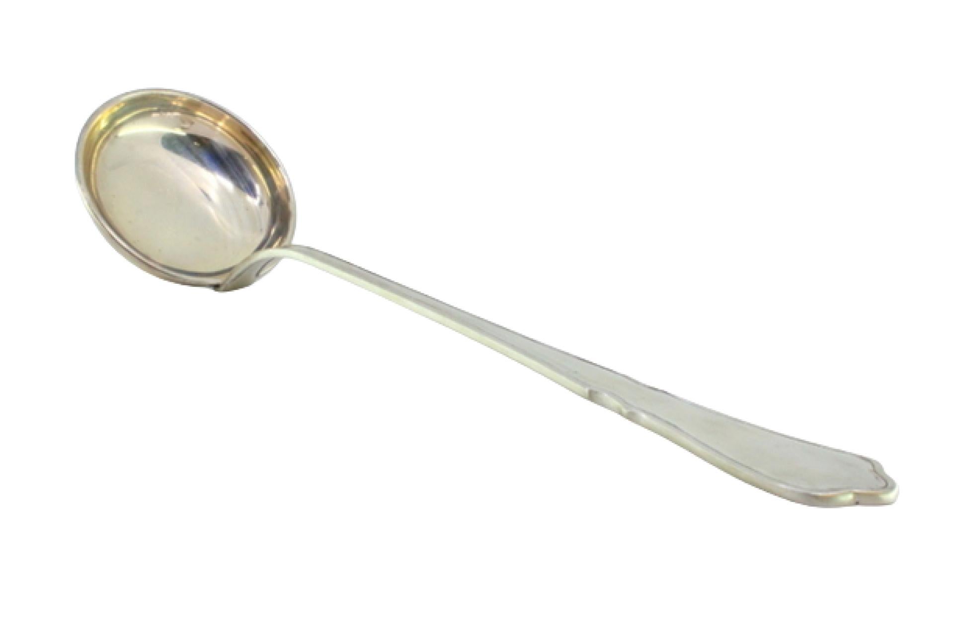 Silver soup ladle with a groove along the scalloped handle