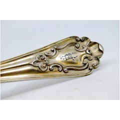 Silver soup ladle with crimped and embossed handle