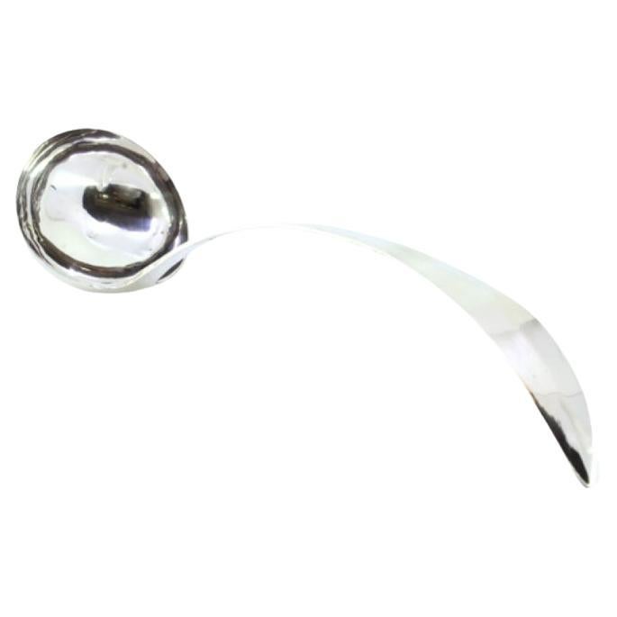 Silver soup ladle with curved handle trim