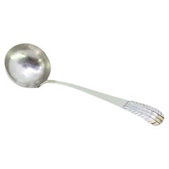 Silver soup ladle with embossed handle