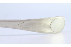 Silver soup ladle with embossed handle in the reed style and monogrammed card