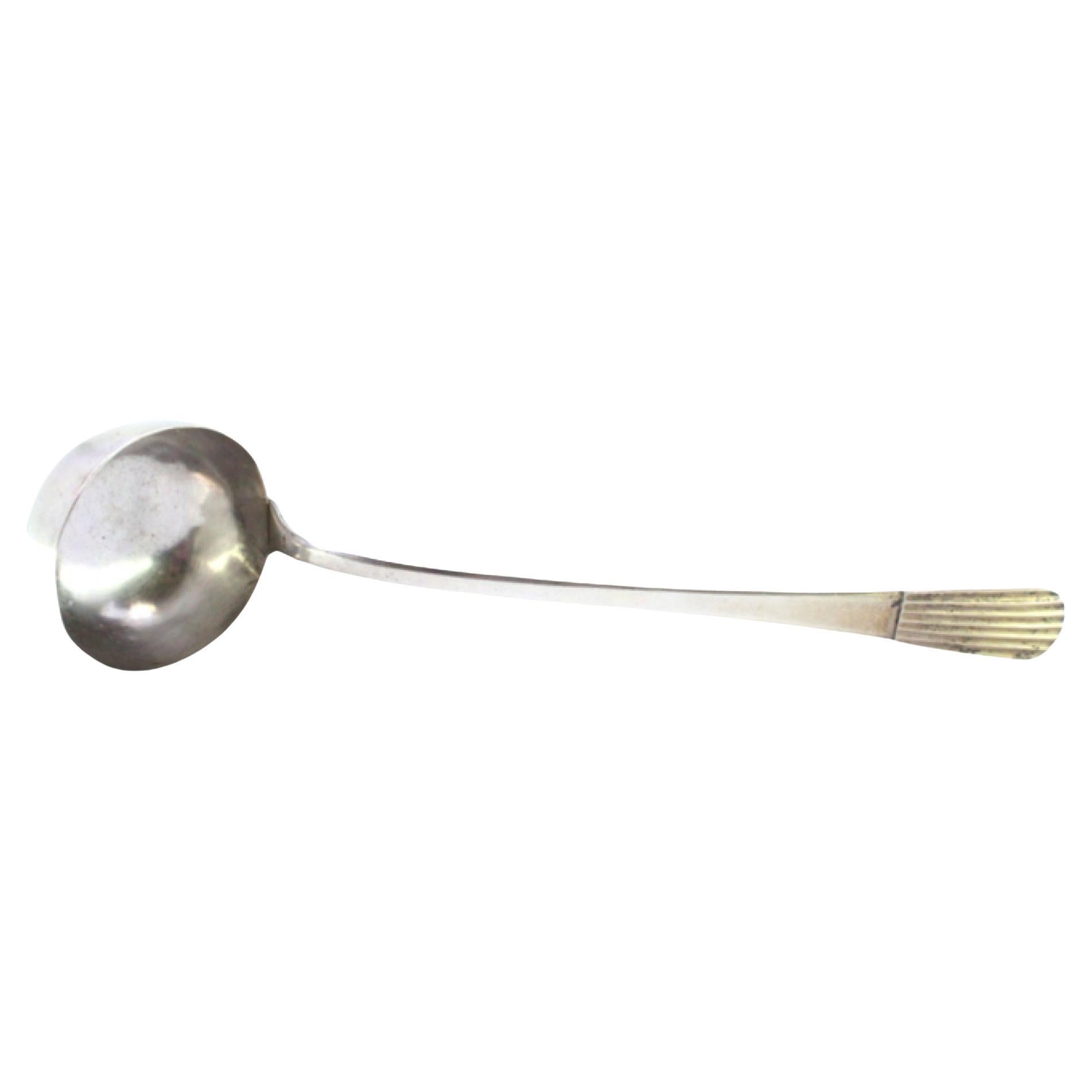 Silver soup ladle with embossed handle in the reed style