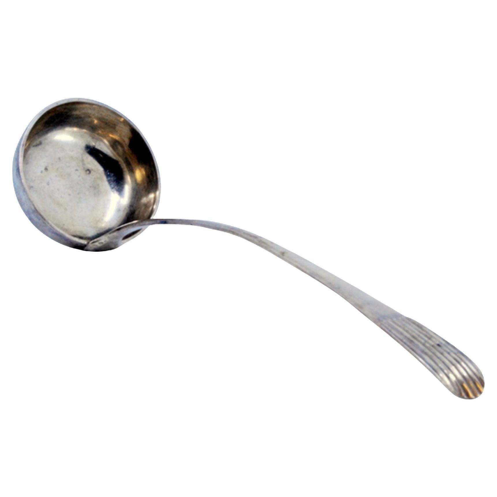 Silver soup ladle with embossed handle in the reed style