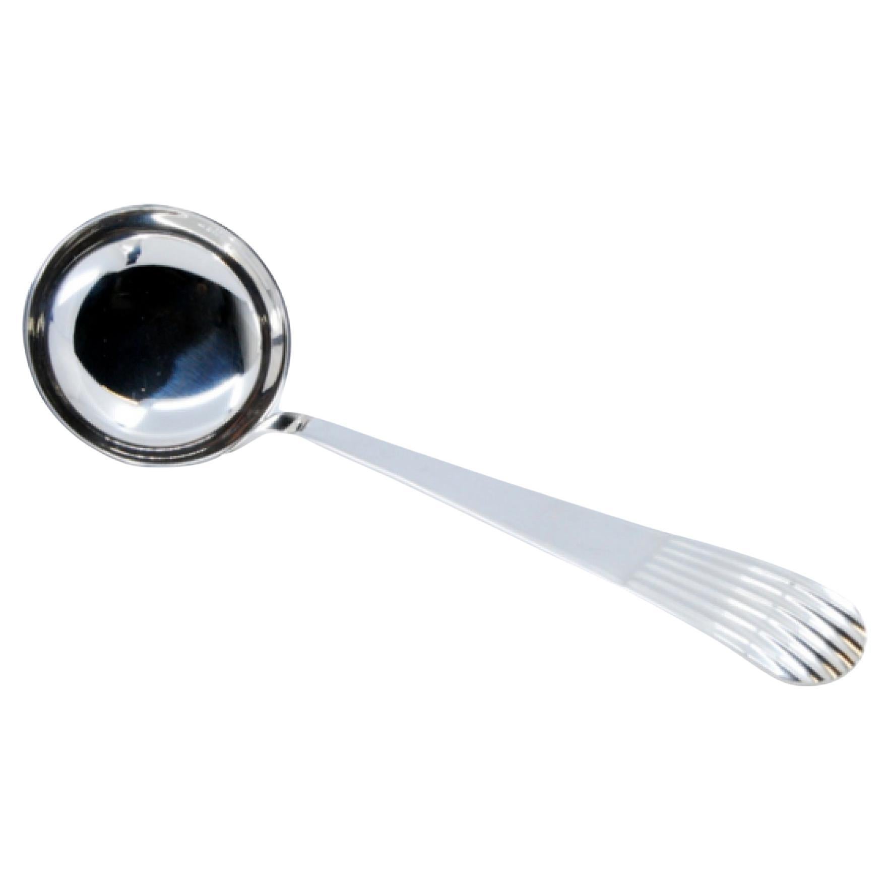 Silver soup ladle with embossed reed-style handle