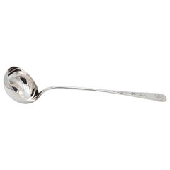 Silver soup ladle with engraved floral motifs