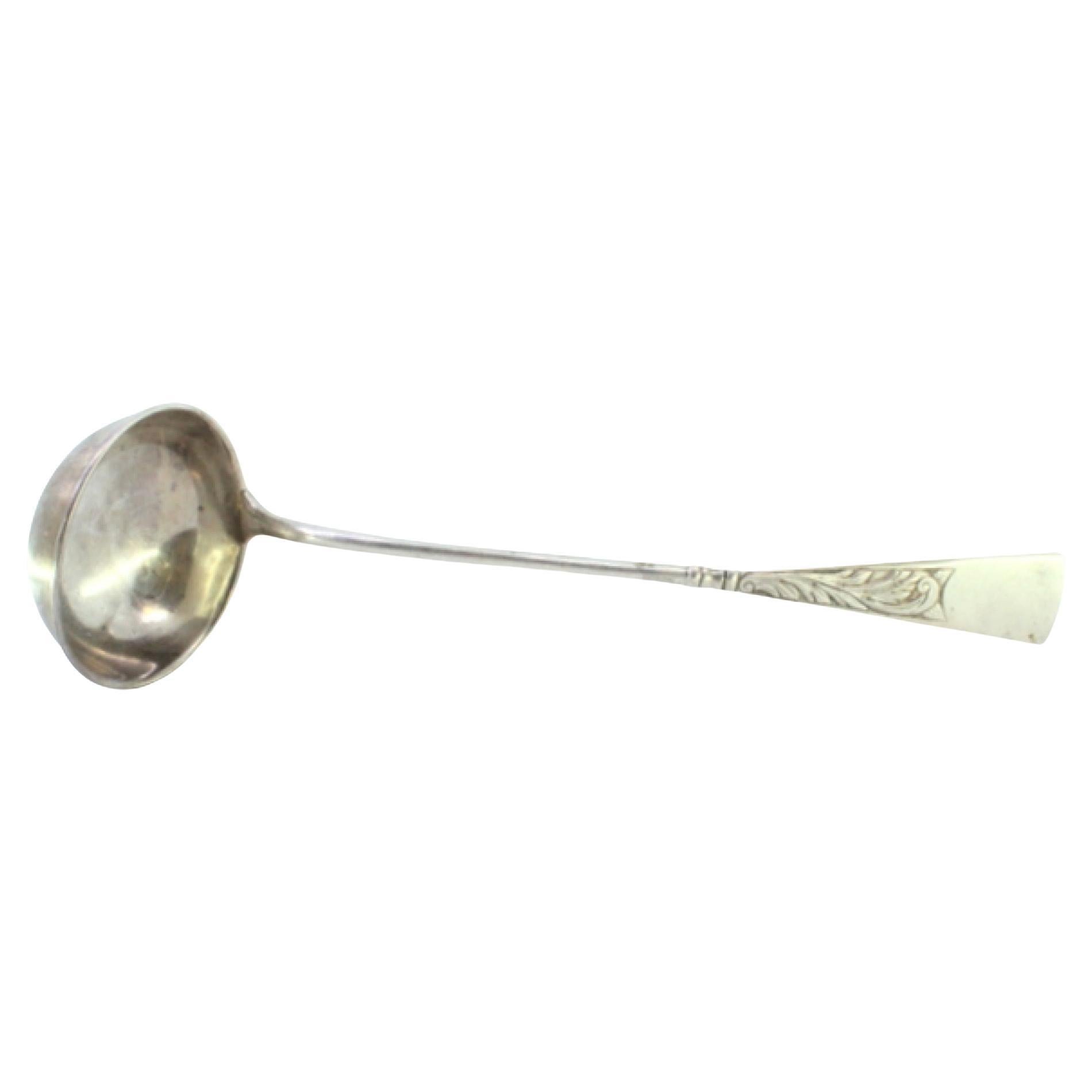 Silver soup ladle with engraving on the handle and a monogram card