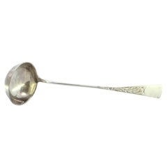 Silver soup ladle with engraving on the handle and a monogram card