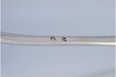 Silver soup ladle with floral relief handle and monogram cartouche