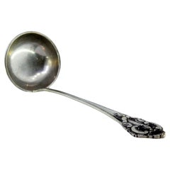 Silver soup ladle with friezes and reliefs on the handle Silver soup ladle with friezes and reliefs on the handle