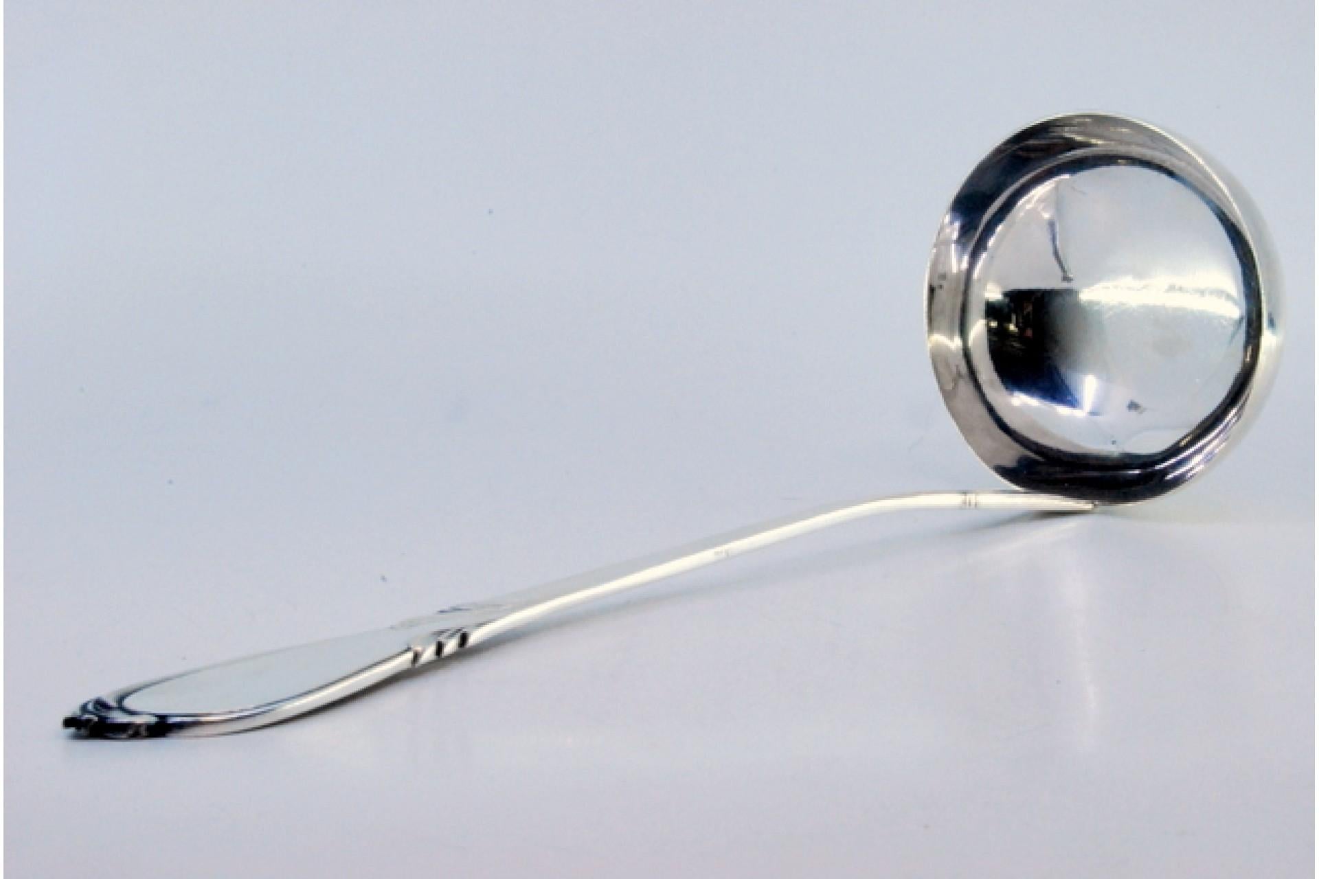 European Silver soup ladle with grooves along the handle and monogram plaque For Sale