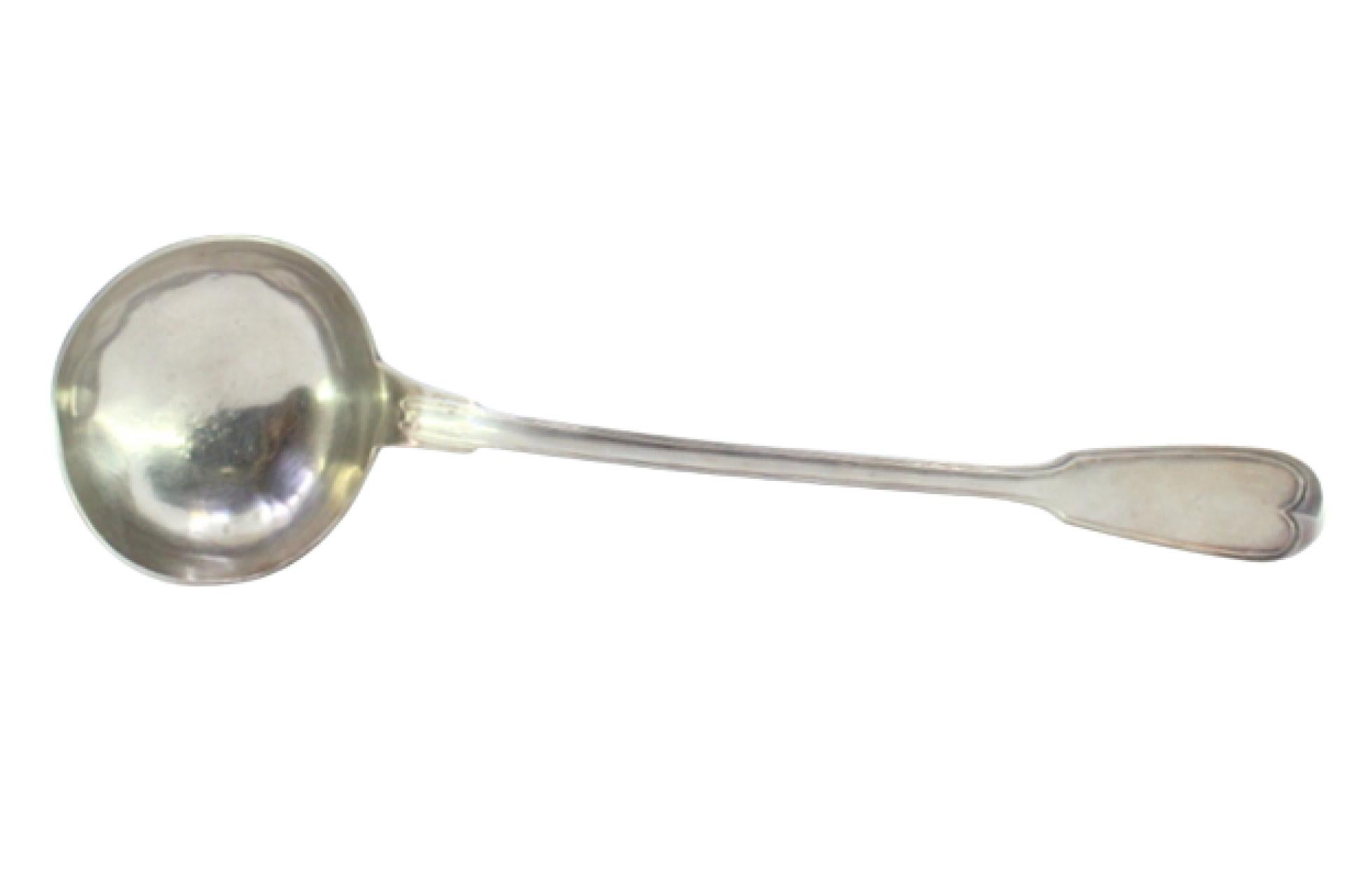 Silver soup ladle with grooves along the handle