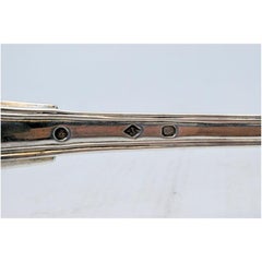 Silver soup ladle with grooves along the handle to be shipped