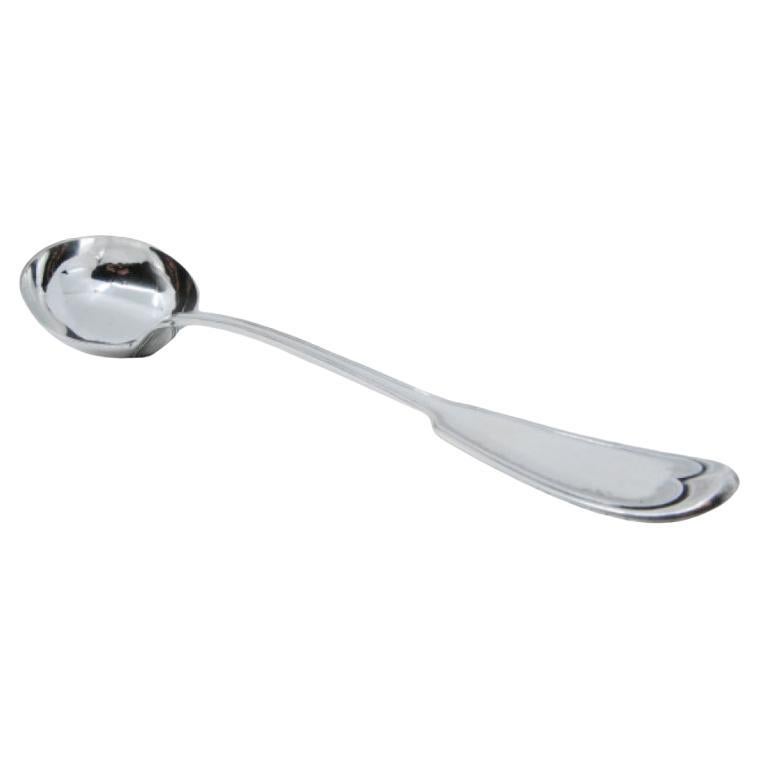 Silver soup ladle with grooves along the handle to be shipped