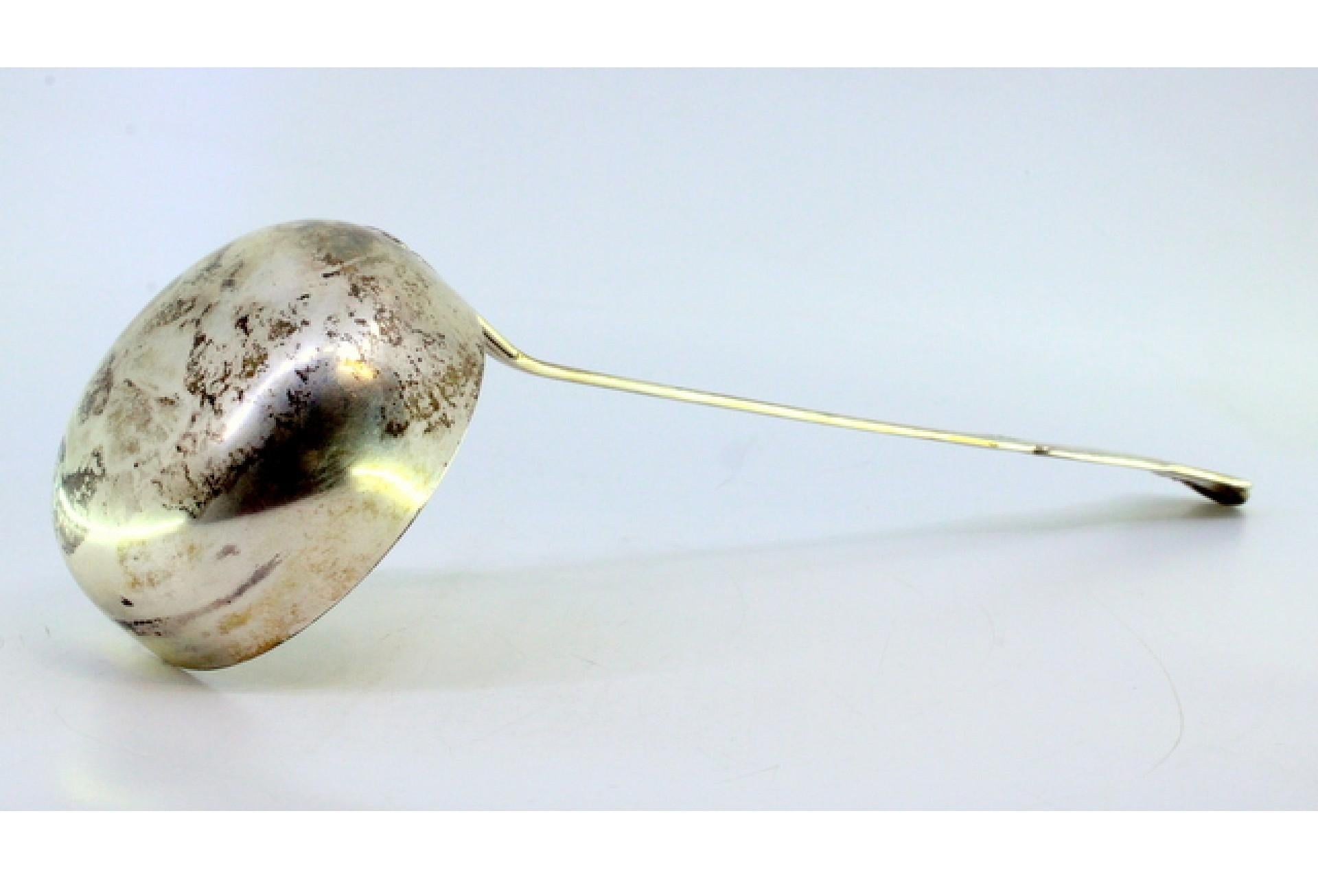 Description: Silver soup ladle with grooves along the cut-out handle. Metal: Silver. Origin: European. Brand: Unknown. Weight: 208.18 grams. Dimensions: 30.5cmx9cm. Content: 800/1000. Assay Mark: Yes. Additional information: Good condition.