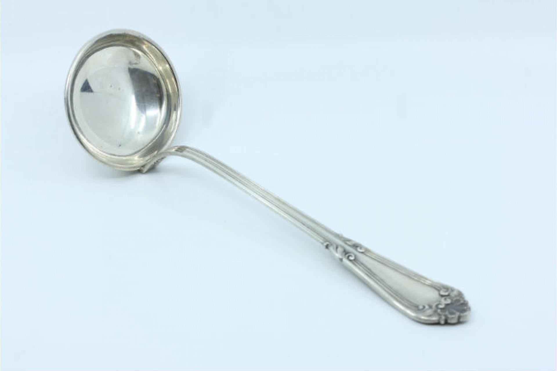 Description: Silver soup ladle with grooves along the shell-shaped handle. Metal: Silver. Origin: Portugal. Brand: open-wing eagle. Weight: 255.33 grams. Dimensions:. Content: 835/1000. Assay Mark: Yes, between 1985 and 2021. Additional information:
