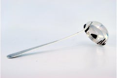 Silver soup ladle with guilloche engraving on the handle with an acanthus flower