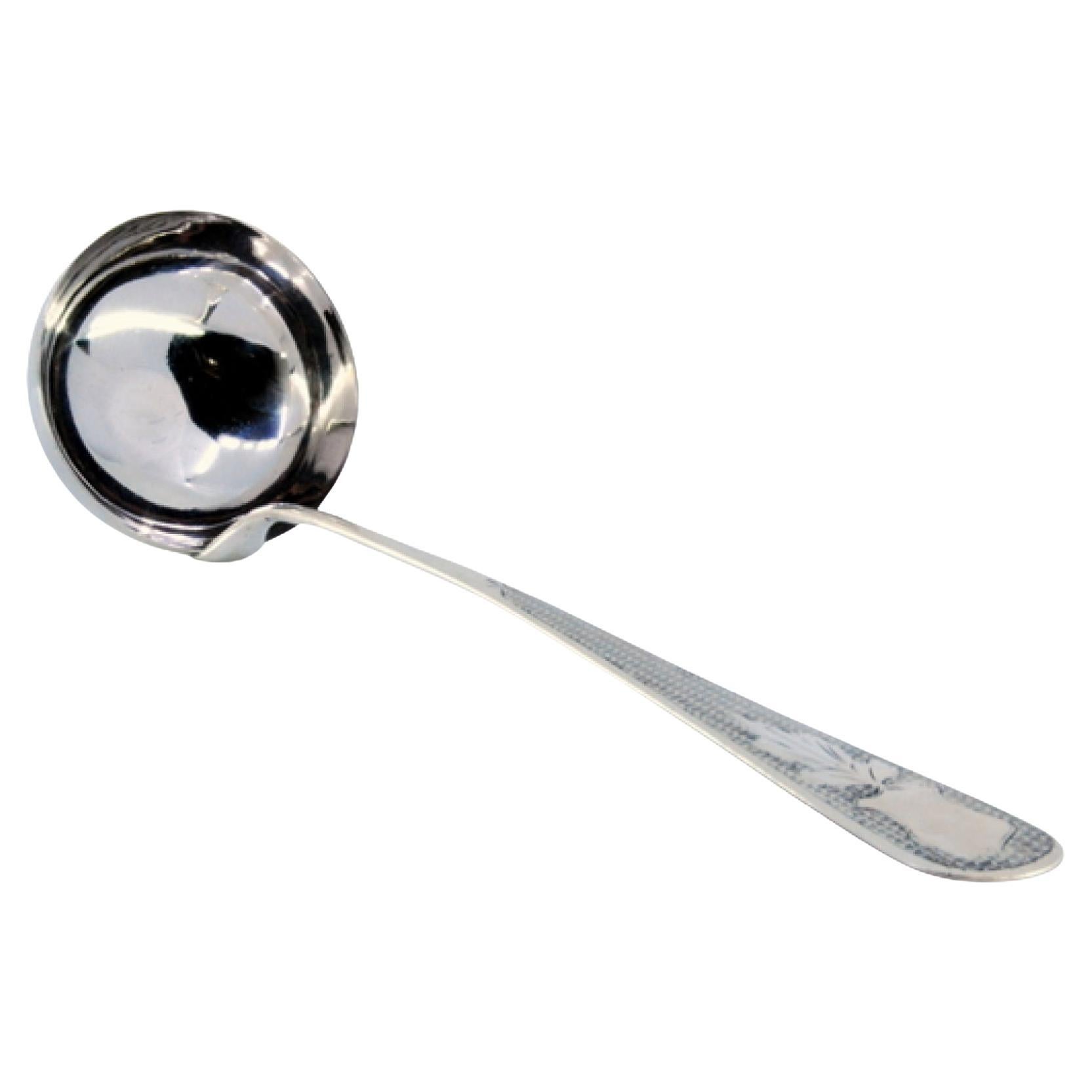 Silver soup ladle with guilloche engraving on the handle with an acanthus flower
