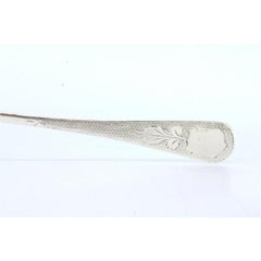 Silver soup ladle with guilloche handle and monogram card