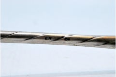 Silver soup ladle with raised handle, monogrammed card and gold ladle