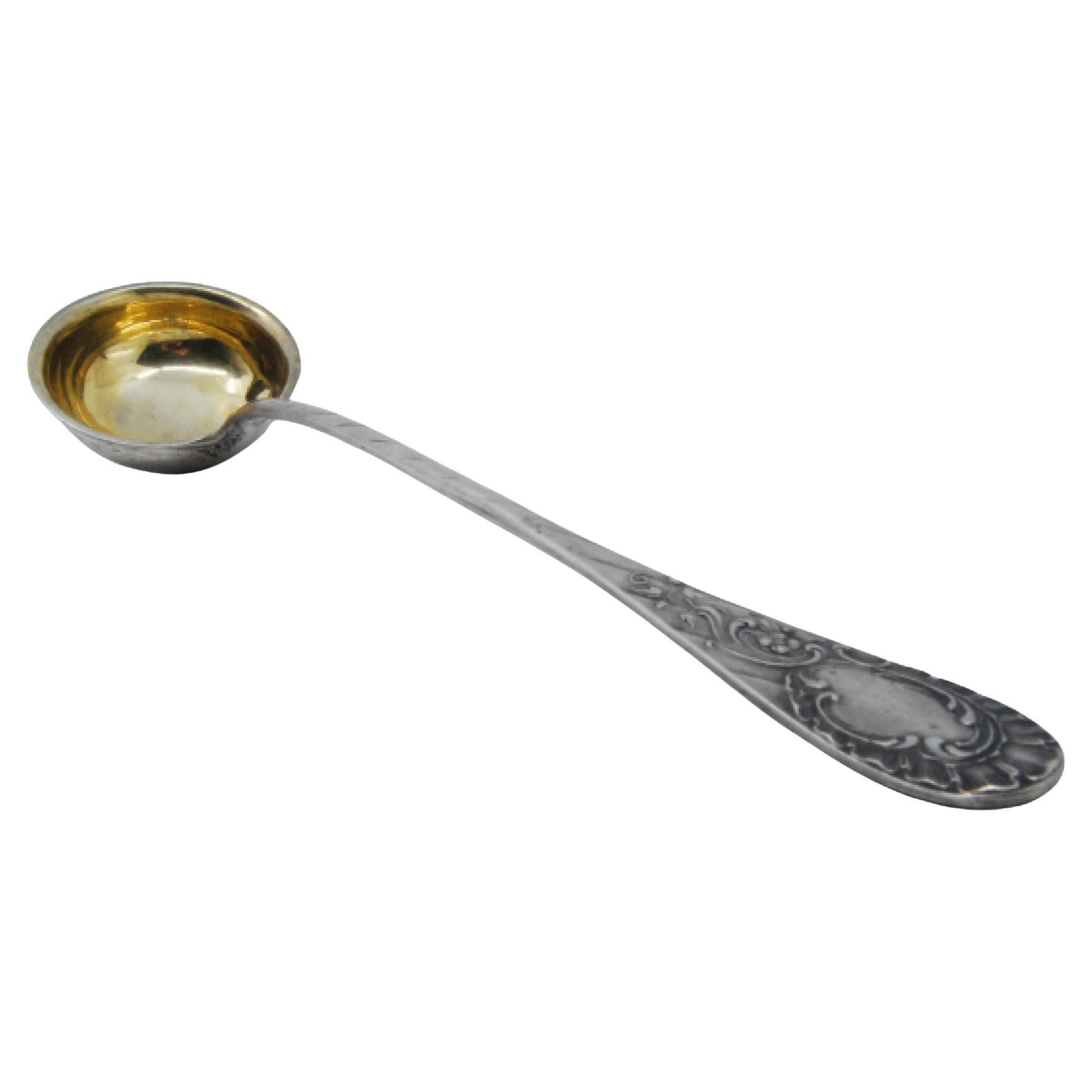 Silver soup ladle with raised handle, monogrammed card and gold ladle