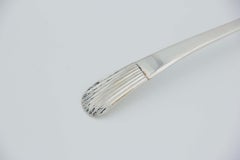 Silver soup ladle with reed-style handle