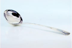 Silver soup ladle with reed-style reliefs on the handle