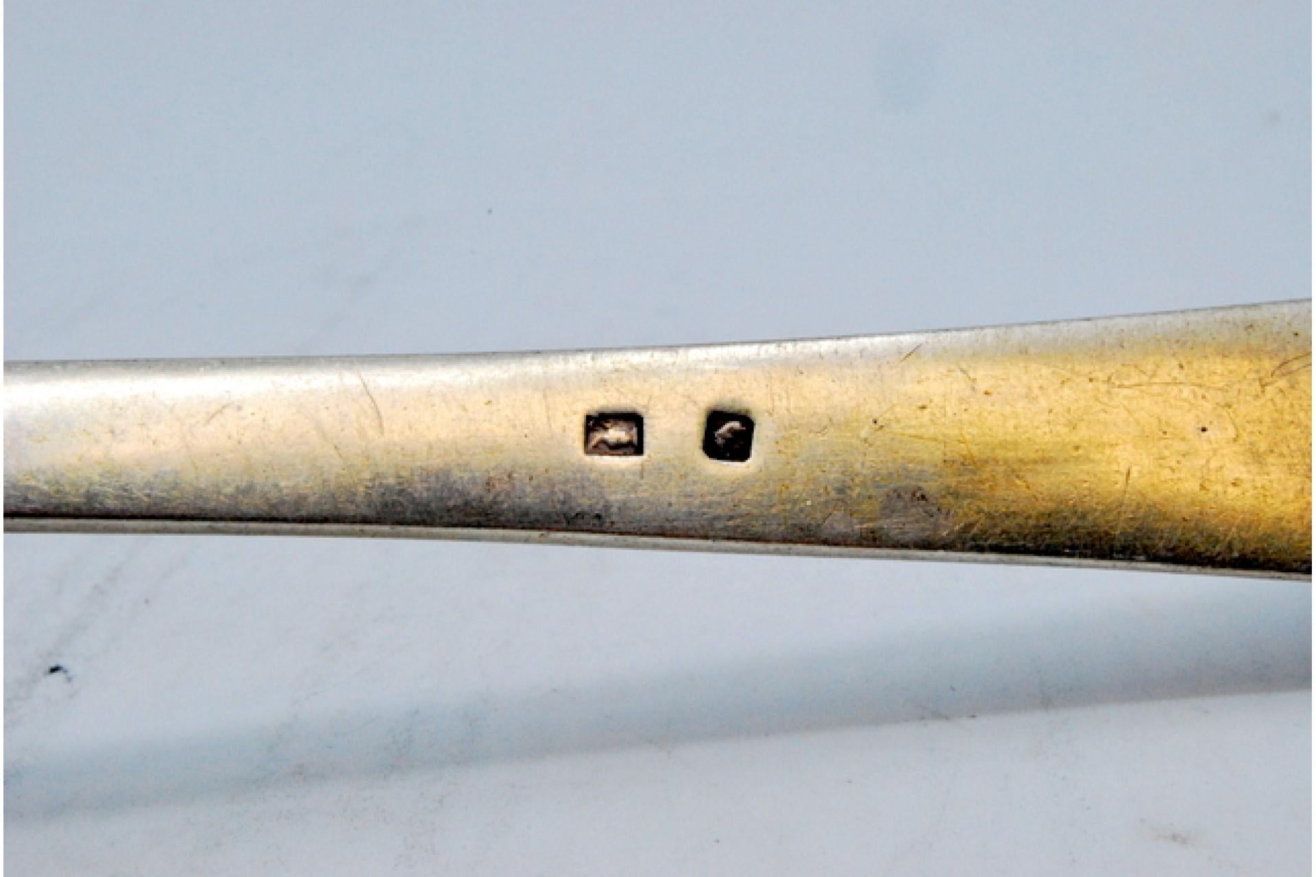 Description: Silver soup ladle with reliefs along the cane-type handle. Metal: Silver. Origin: Portuguese. Brand: javali II Title. Weight: 182.97 grams. Dimensions: 29x8.5cm. Content: 833/1000. Assay Mark: Yes. Additional information: Good condition