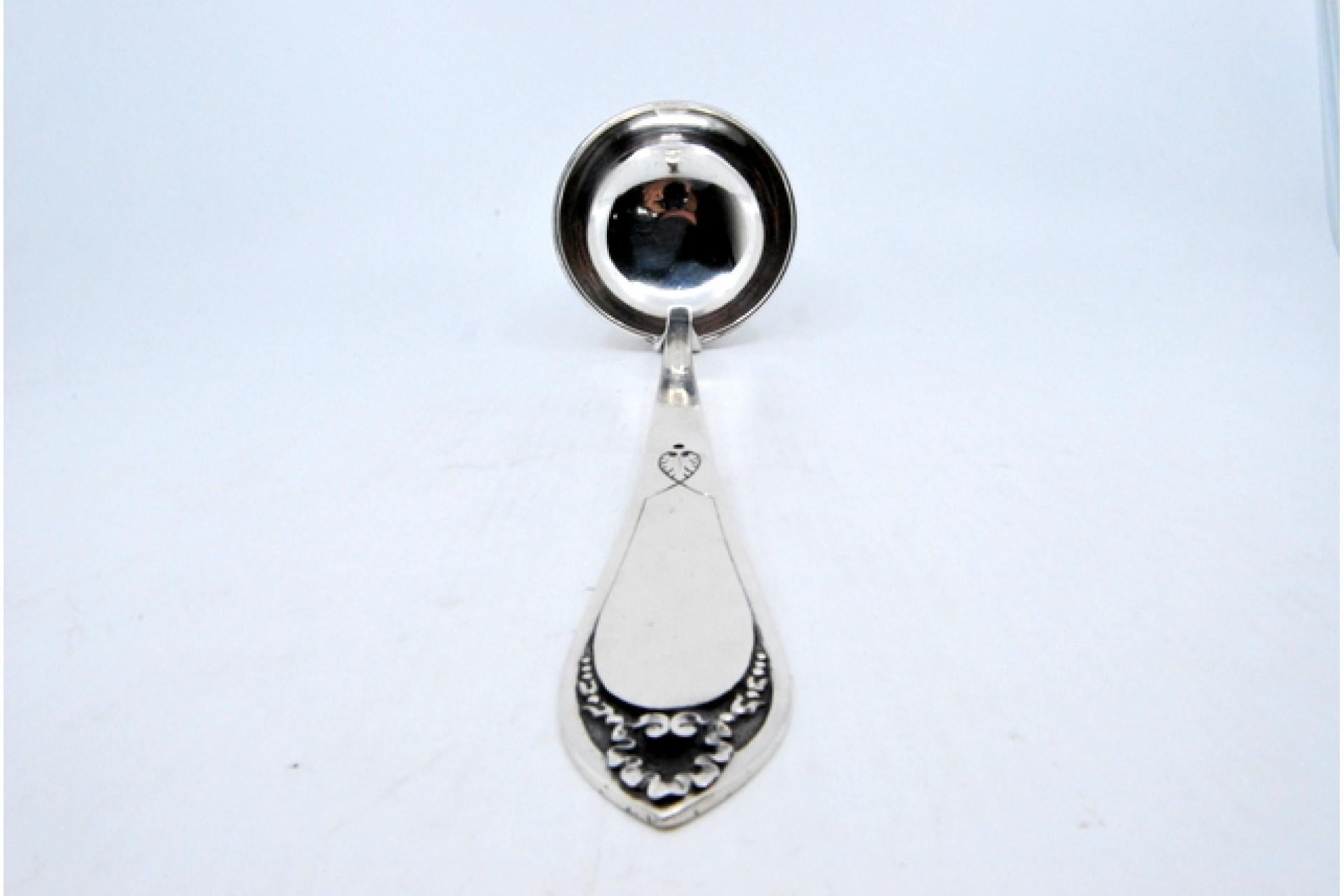 European Silver soup ladle with reliefs surrounding a monogram card For Sale