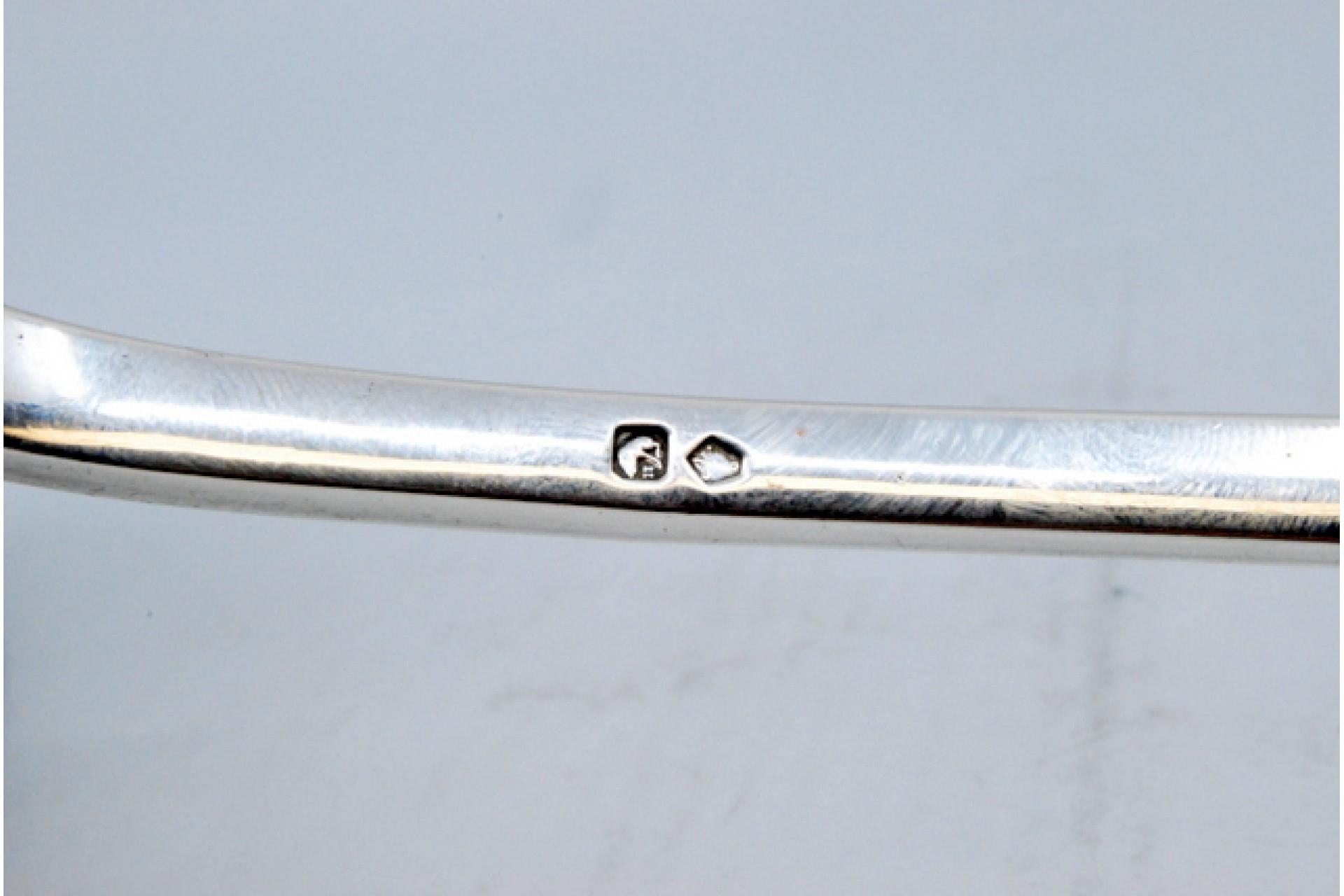 19th Century Silver soup ladle with reliefs surrounding a monogram card For Sale