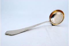 Silver soup ladle with scalloped handle and trim