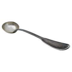 Silver soup ladle with scalloped handle