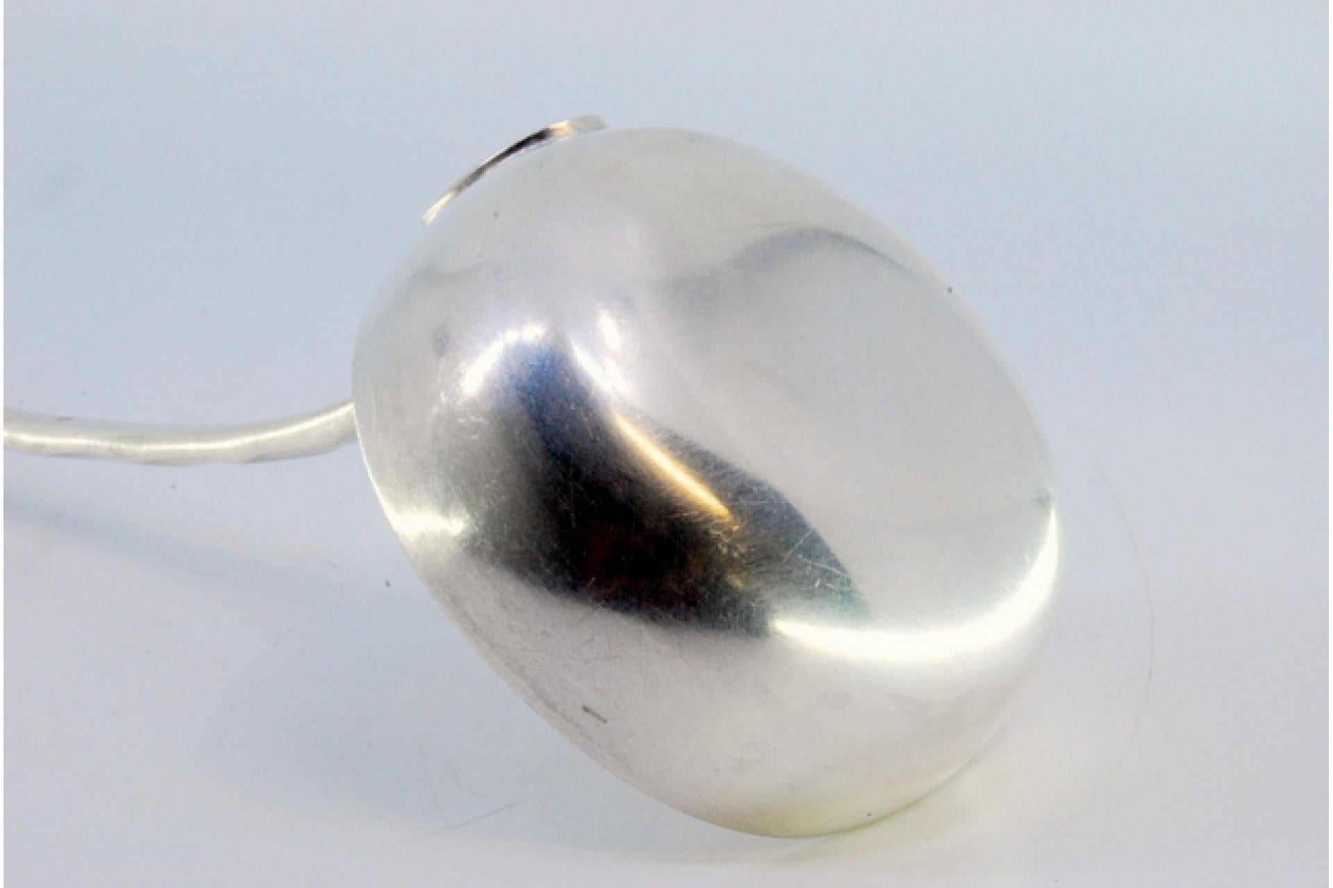 European Silver soup ladle with wavy reliefs on the handle, surrounding a monogram card For Sale