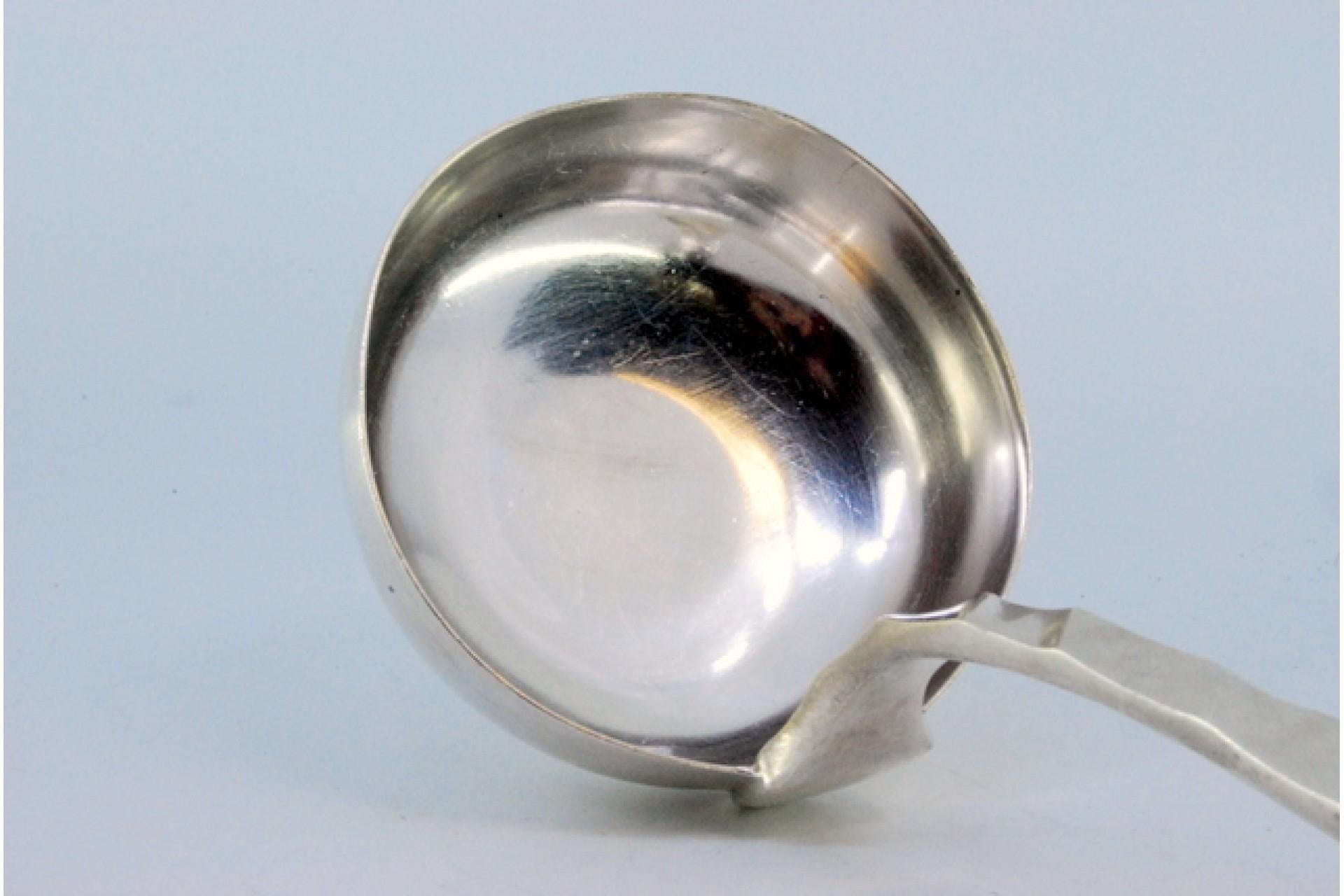 19th Century Silver soup ladle with wavy reliefs on the handle, surrounding a monogram card For Sale