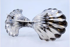 Silver spice rack shaped as shells with beaded rim on four feet