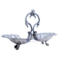 Silver spice rack shaped as shells with beaded rim on four feet