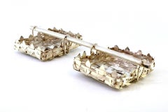 Silver spice rack with two basket-shaped containers held by a clothesline