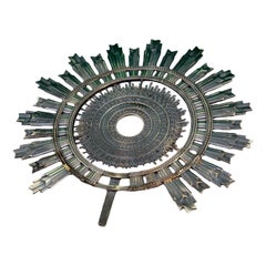 Silver splendor symbolizing the Sun and its rays with concentric reliefs