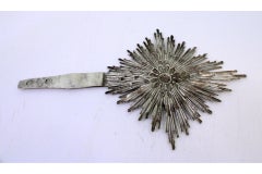 Silver splendor with floral reliefs in the center