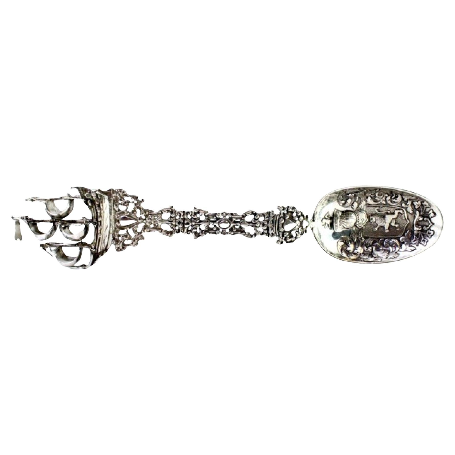 Silver spoon set with friezes, cutouts, caravel finial and coat of arms