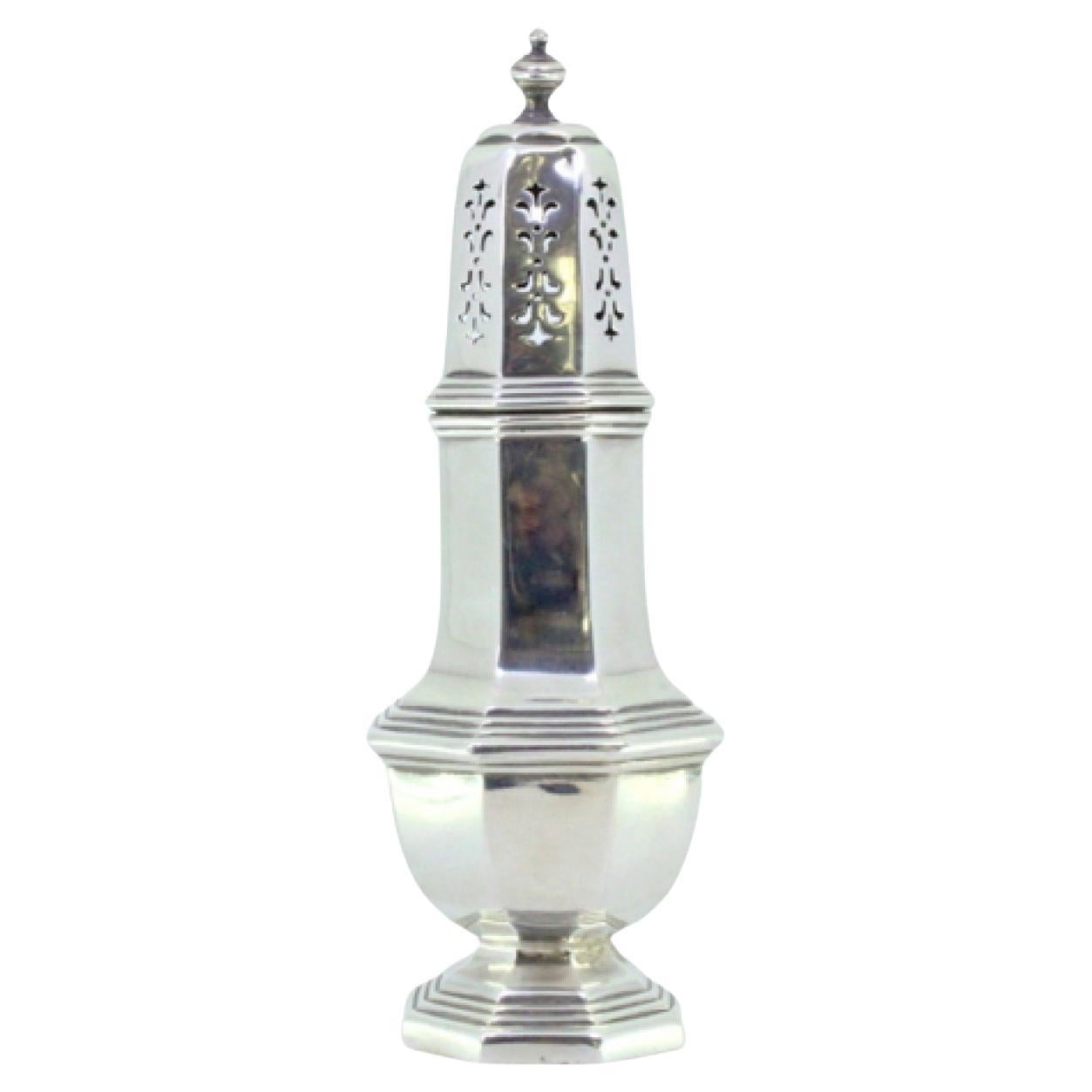 Silver sprinkler in octagonal shape with knob on the lid