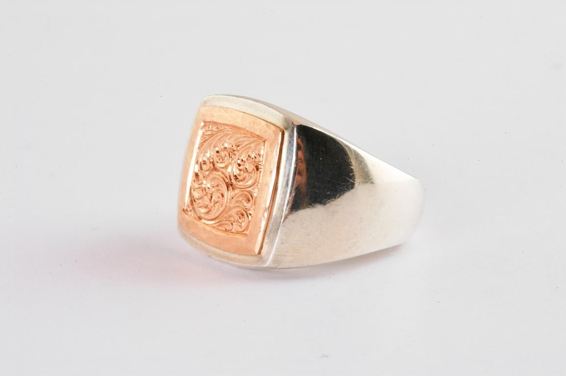 Handmade in Notting Hill, London by British jeweller Malcolm Betts, this silver square signet ring with 18ct rose gold hand engraved detail is a one of a kind piece. Using ancient hand engraving techniques no two pieces will ever be the same. A