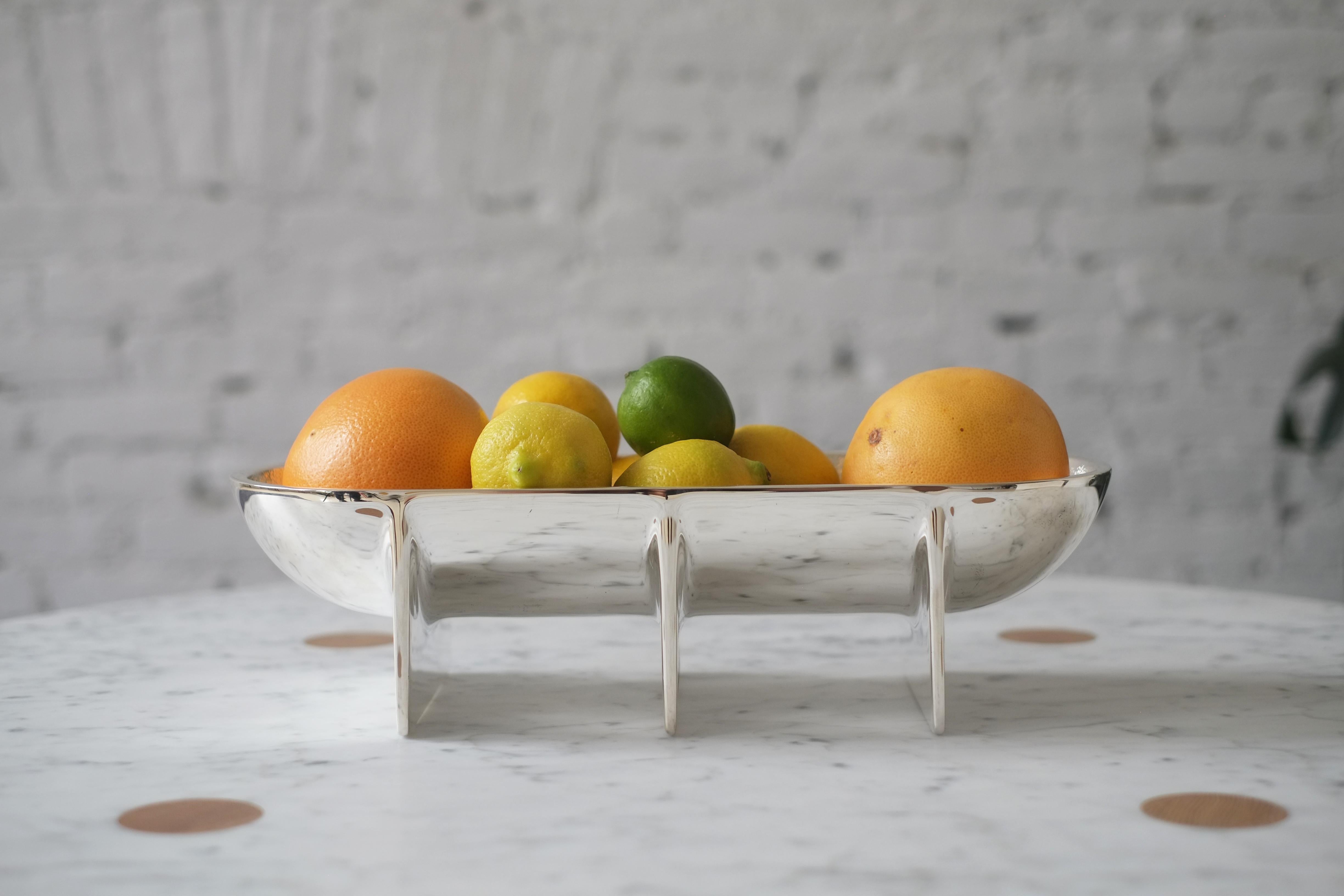 This standing bowl explores silver, a new material for FS. The pure silver plated exterior beautifully showcases the classic standing bowl form and mirrors the space it lives within, providing a special centerpiece for any room.

Bowl is made in