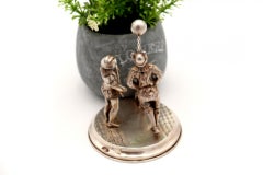 Silver statuette with a group of acrobats and a dog