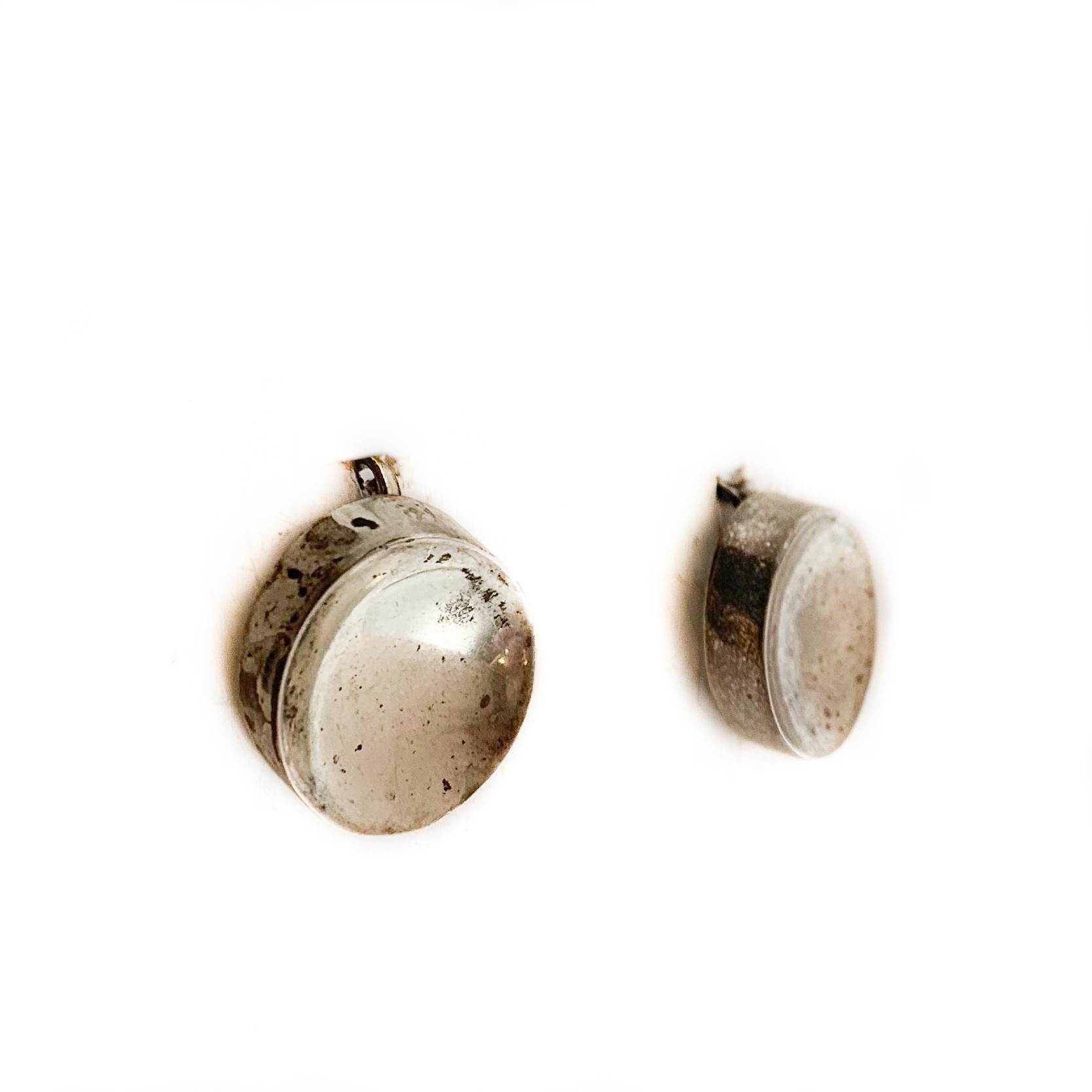 Circle shaped silver stud earrings. 