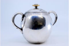 Silver sugar bowl w/ edge engravings of child picking fruit & floral lid